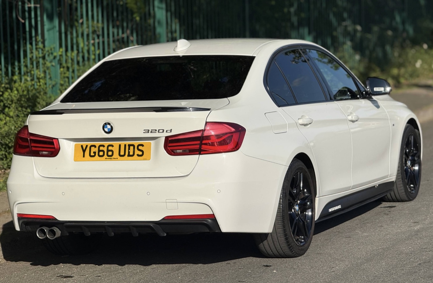 Rear view of a white BMW 320d M Sport at Autoline MCR